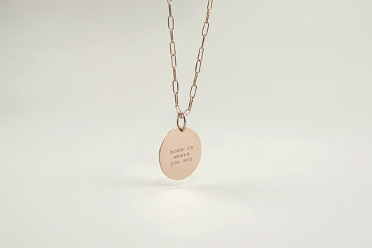 Necklace with a pendant on a light gray background