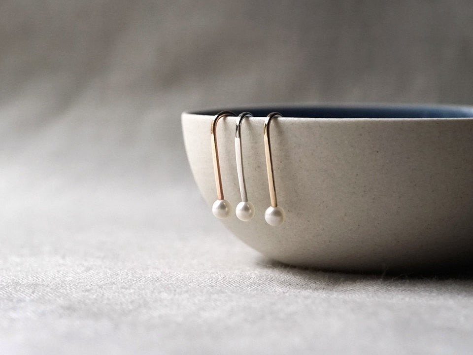 Minimalist Tiny Pearl Ear Pin Earrings with a bowl