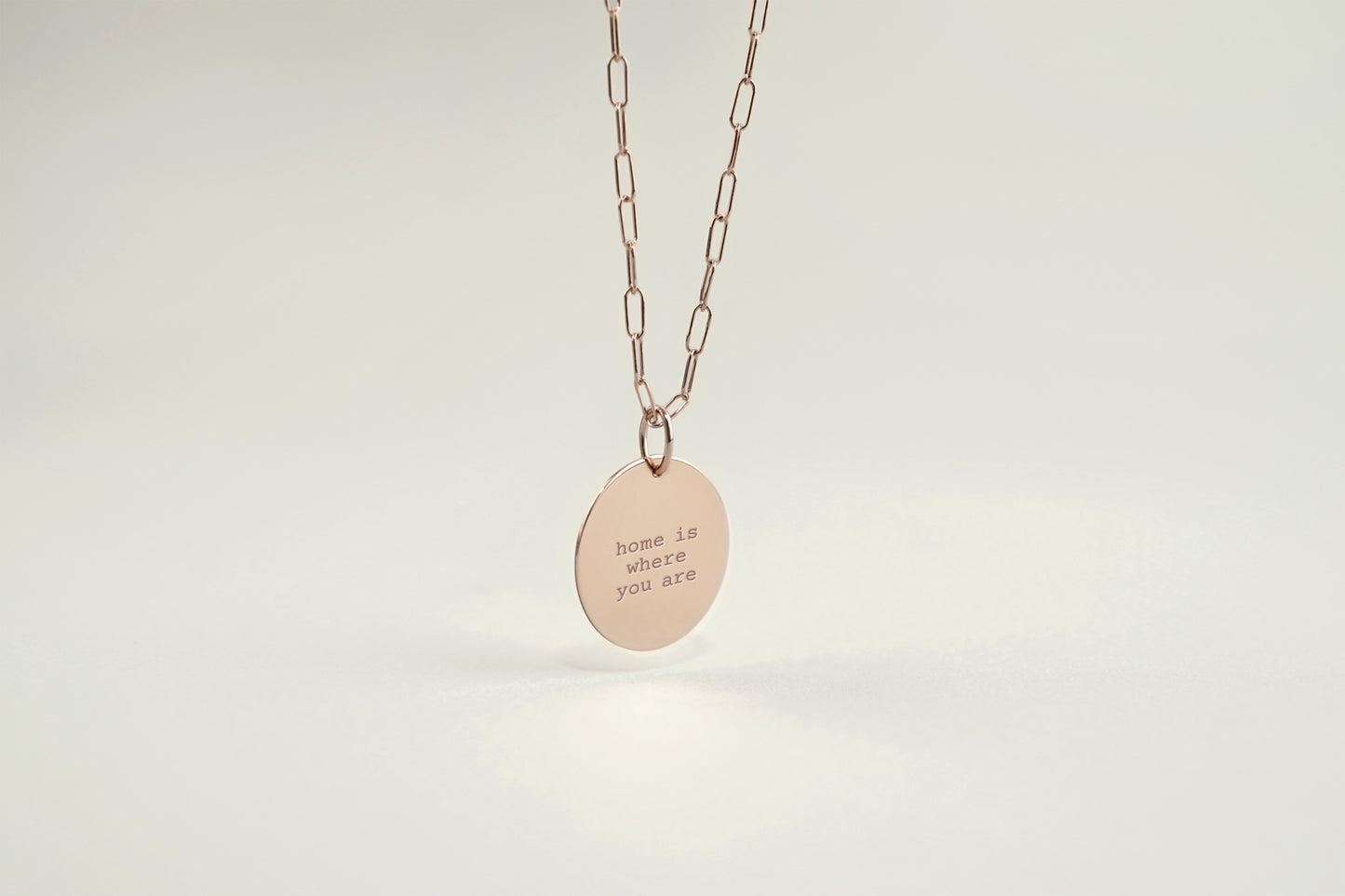 Necklace with a pendant on a light gray background